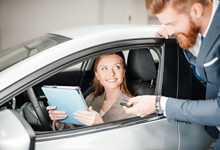 Woman in a car discussing Car Insurance in Los Alamitos, CA