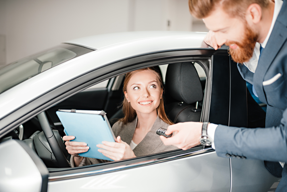 Woman in a car discussing Auto Insurance in Huntington Beach, Signal Hill, CA, Anaheim, and Surrounding Areas